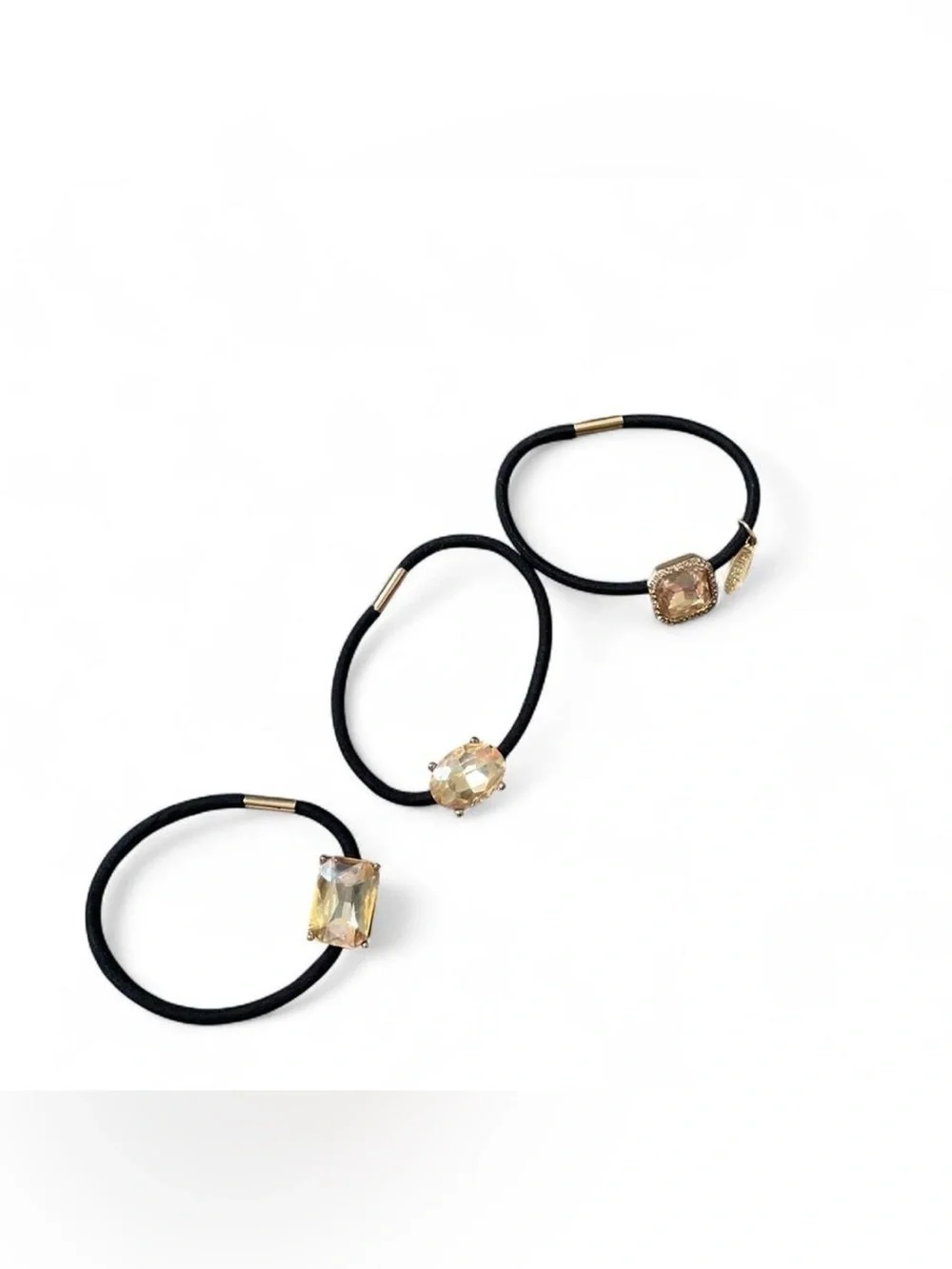 black hair ties with gold accents